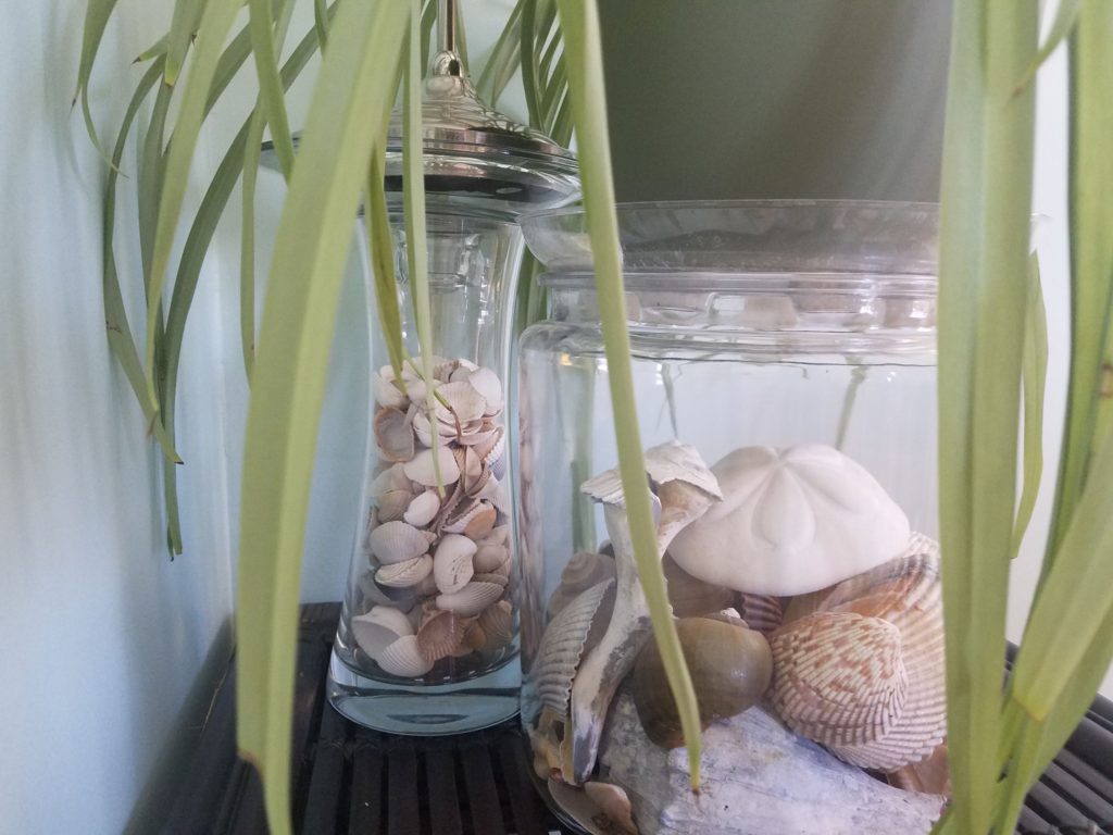 Clear glass filled with favourite décor objects create an inviting space