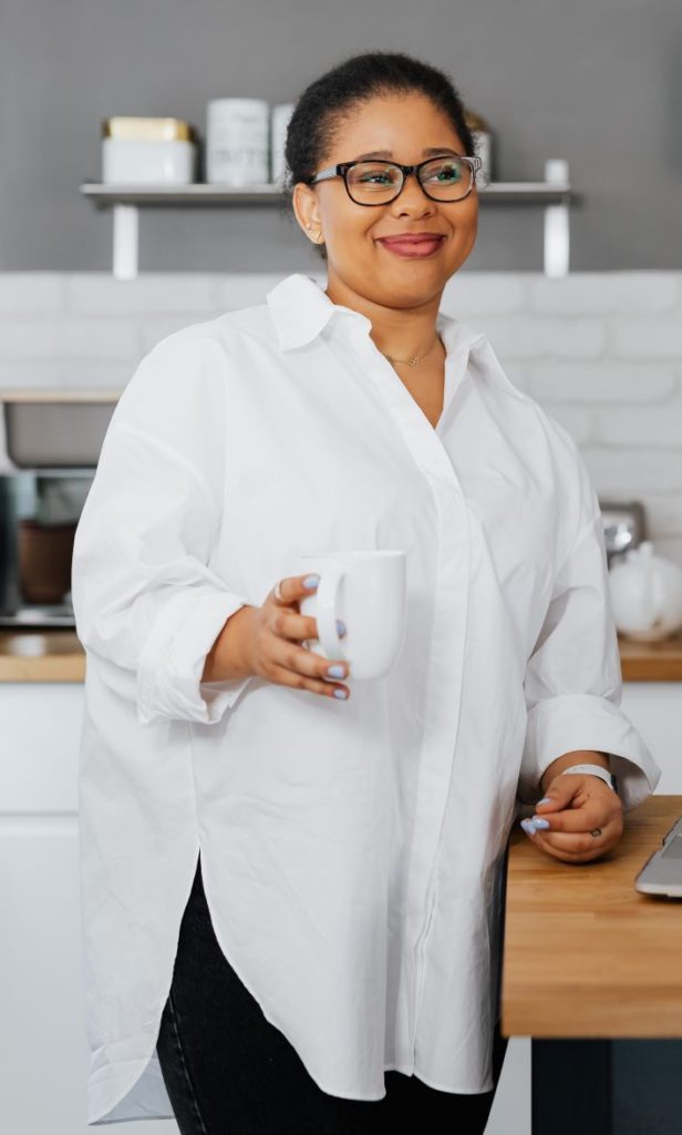 A crisp, classic white button-down blouse can be worn while breastfeeding