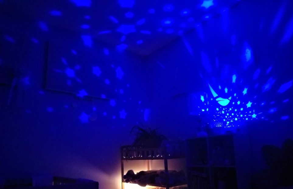 Star globe and salt lamp on at night