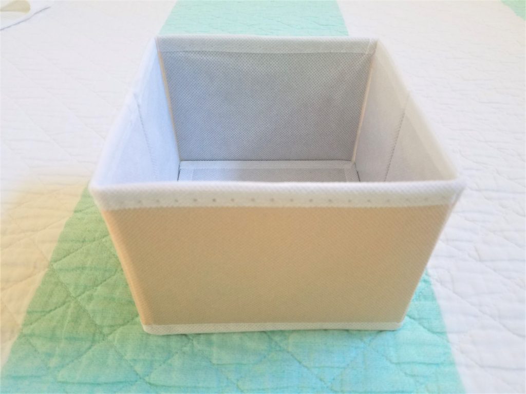 This square peach bin perfectly fits any small thing