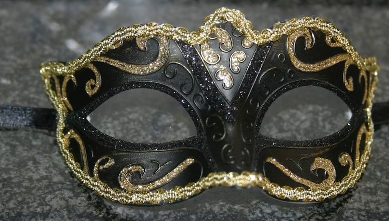 Gold-trimmed black masquerade mask