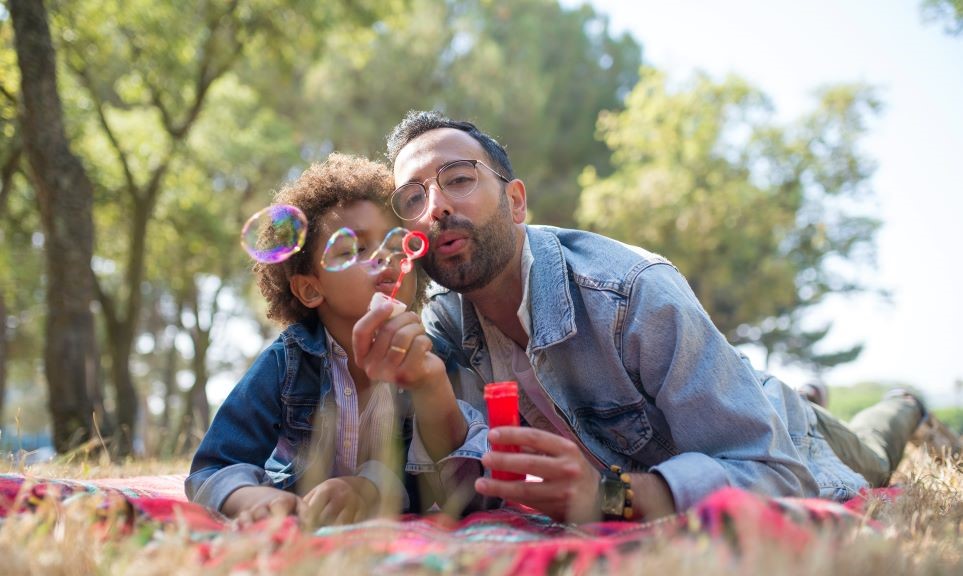 Father and son blowing bubbles