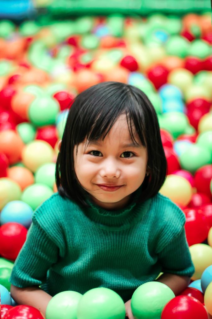 Girl in ball pit