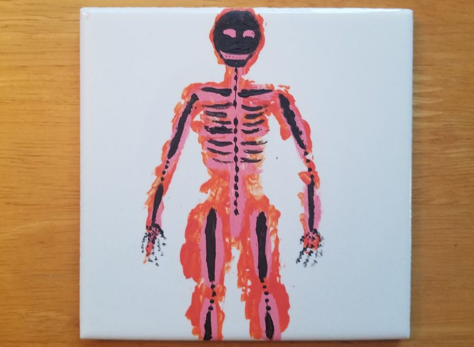Skeleton in black against pink and orange