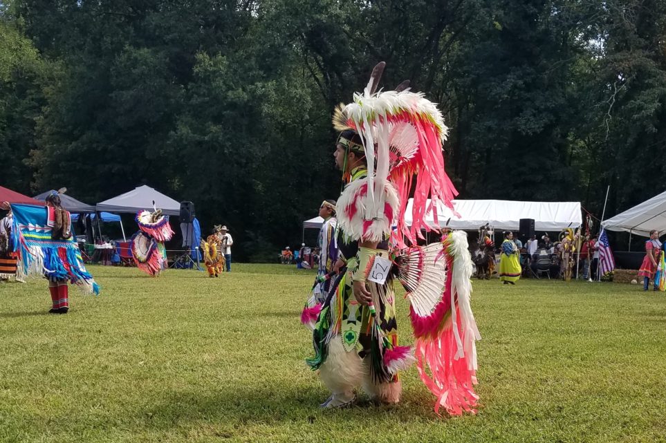 Man performing in Guilford Native American Association Pow Wow