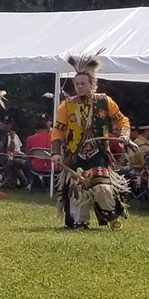 Man performing at Guilford Native American Association Pow Wow