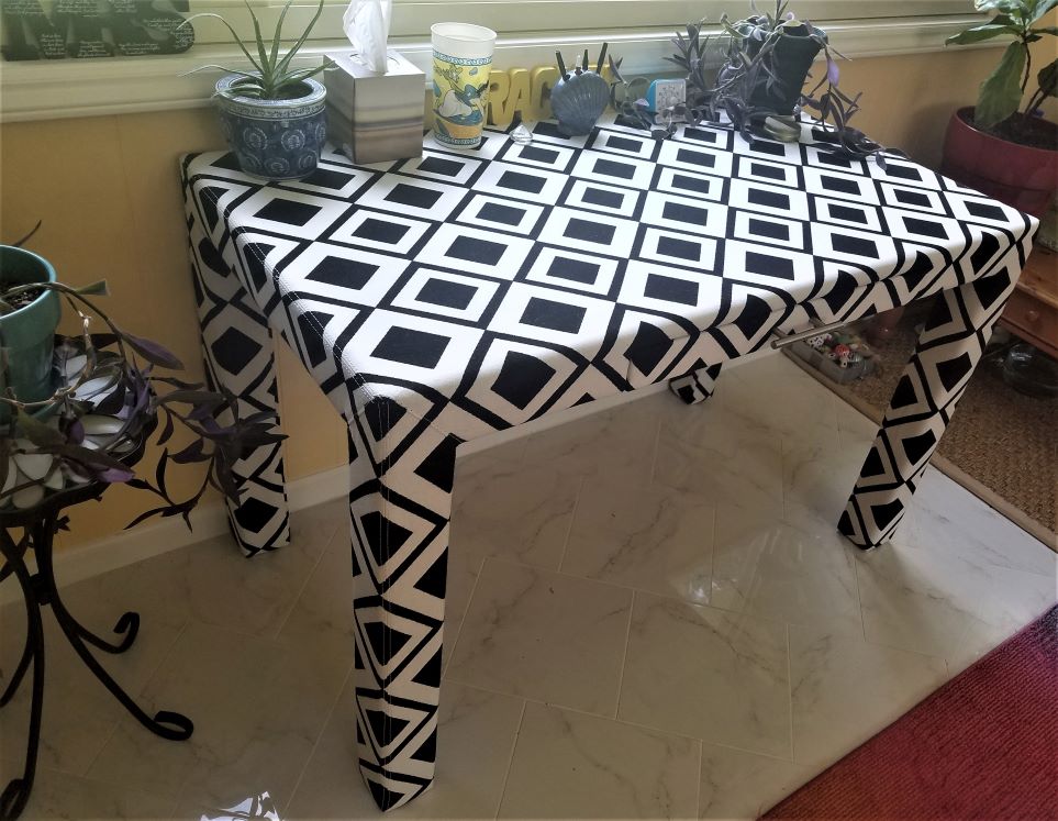 Black and white upholstered desk