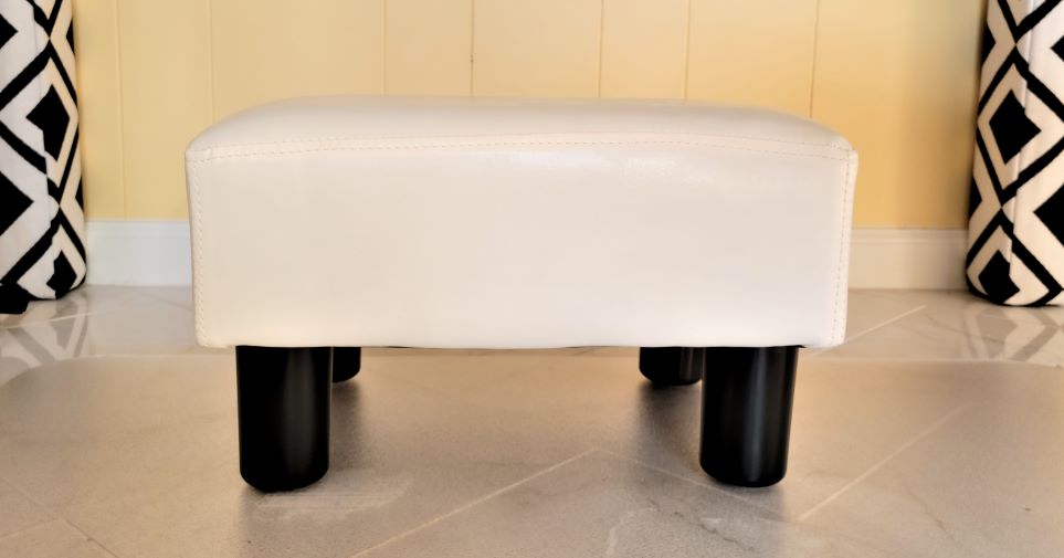 Photo of white foot stool with black legs
