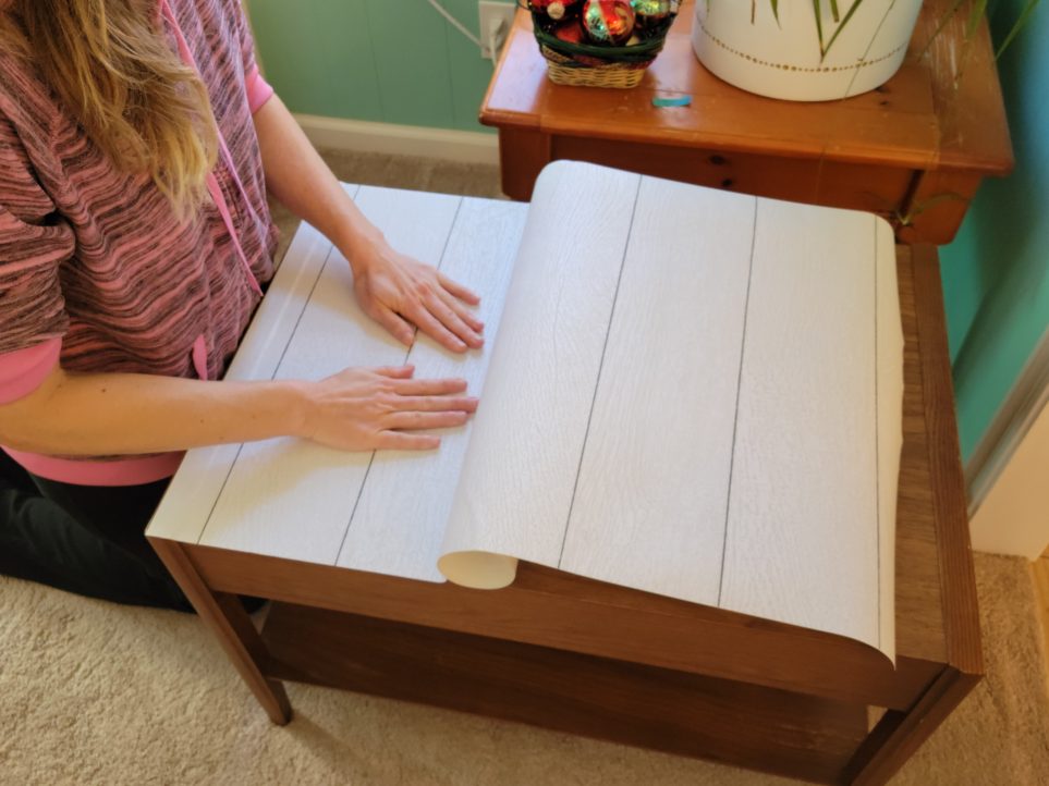 Smoothing out paper on table top