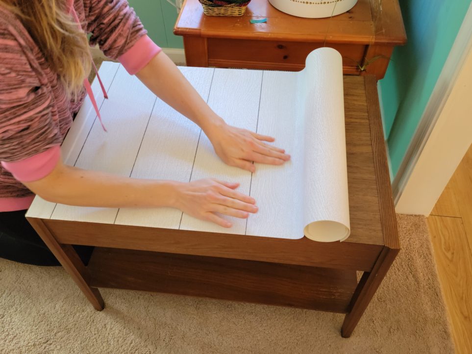 Smoothing out air bubbles to one side, then the other