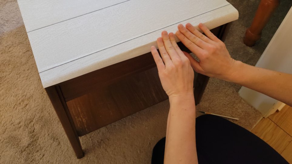 Smoothing out paper over edge