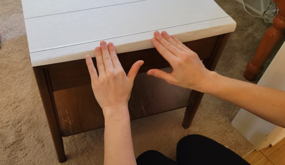 Smoothing paper across edge