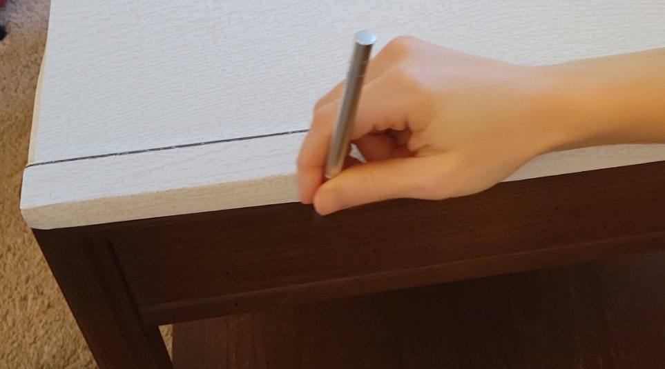 Trimming along edge with X-Acto knife