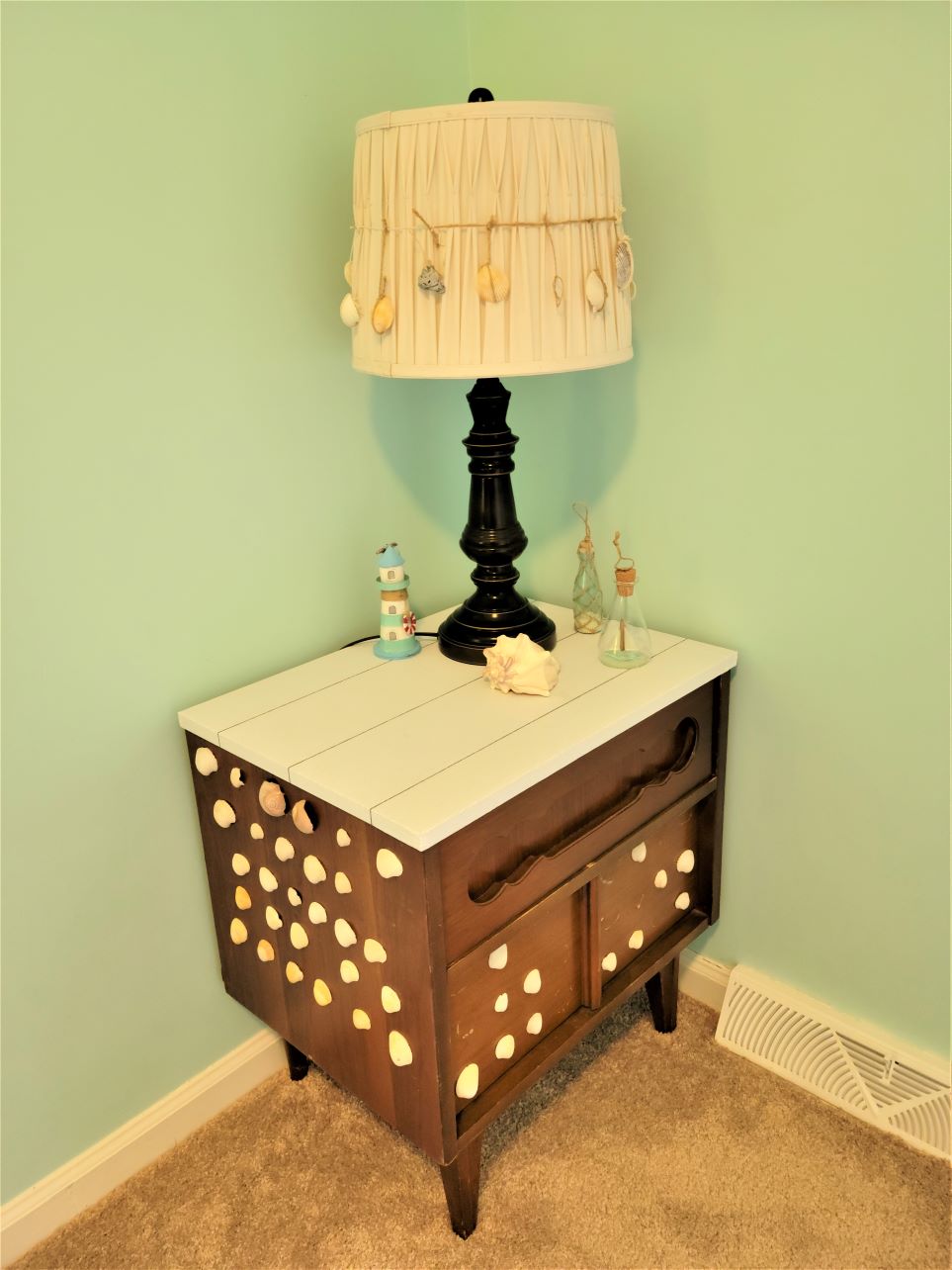 Shiplap peel and stick wallpaper on small tabletop in bedroom