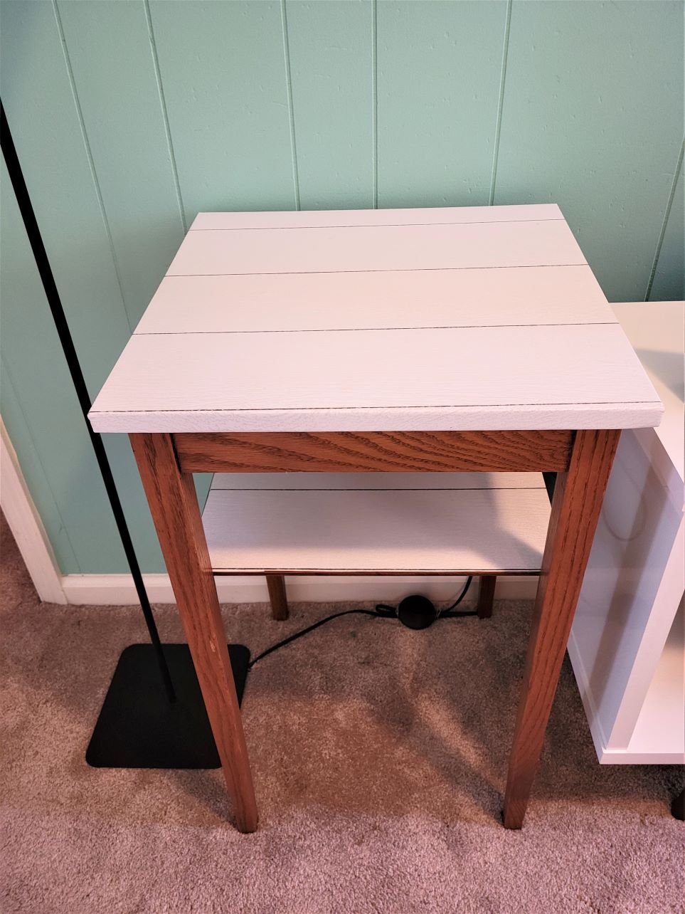 Shiplap peel and stick wallpaper applied to table top and lower shelf of small table