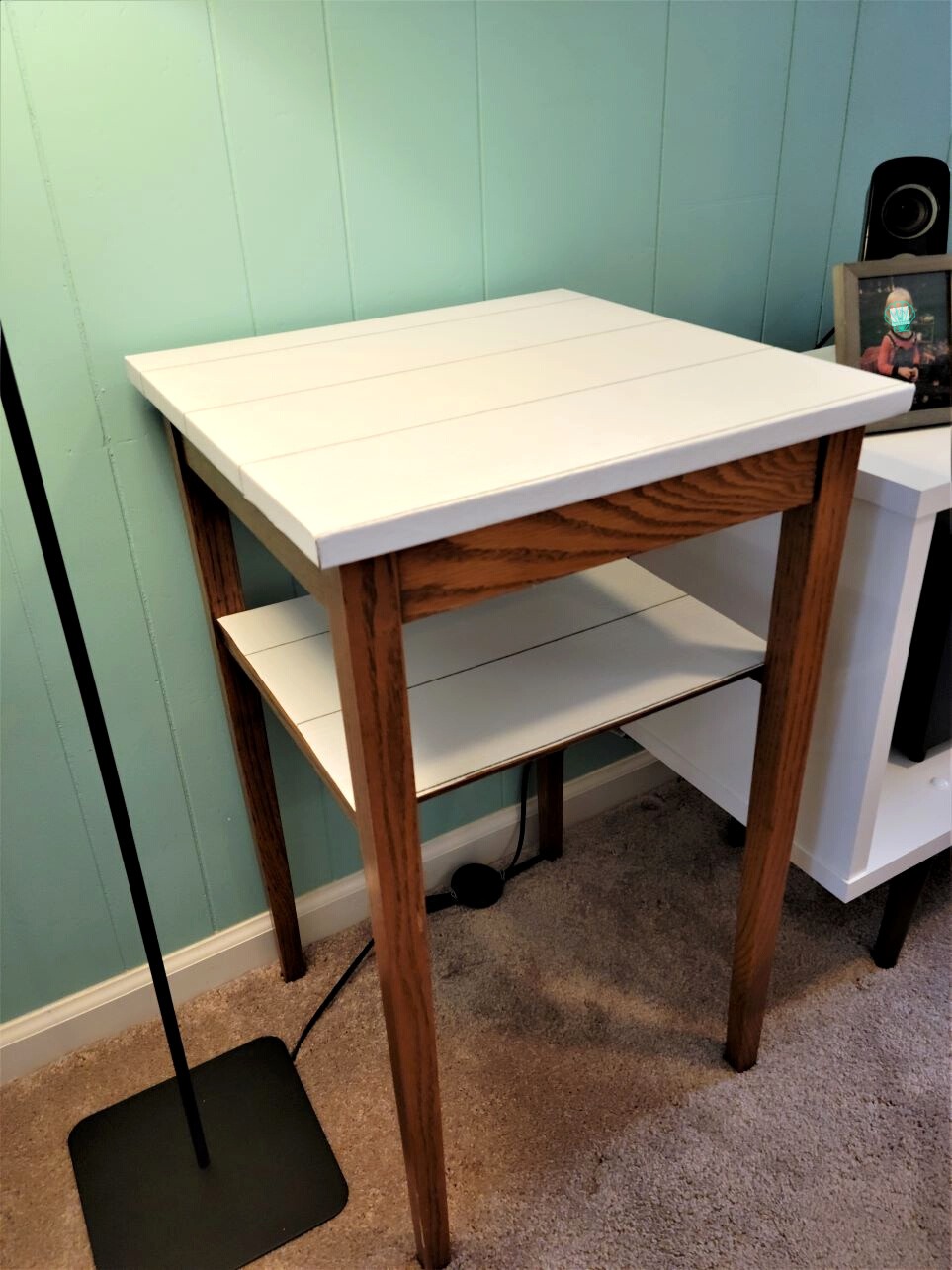 Shiplap peel and stick wallpaper on both top and lower shelf of small table