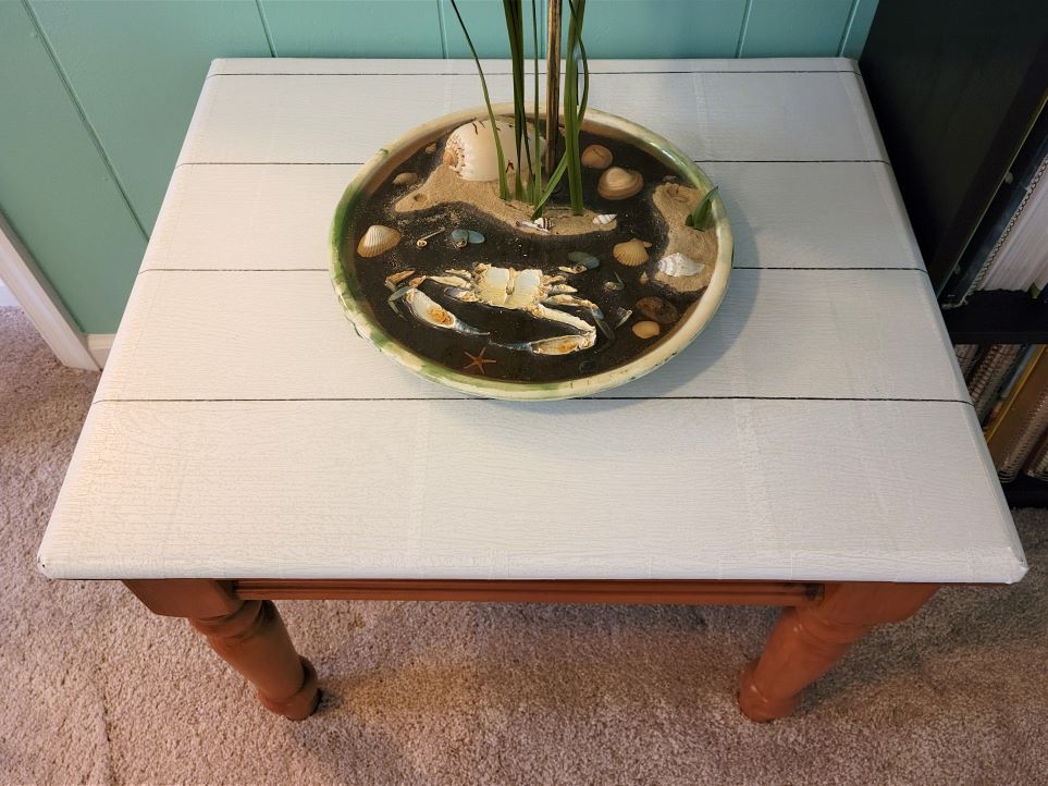 Shiplap peel and stick wallpaper applied to top of end table