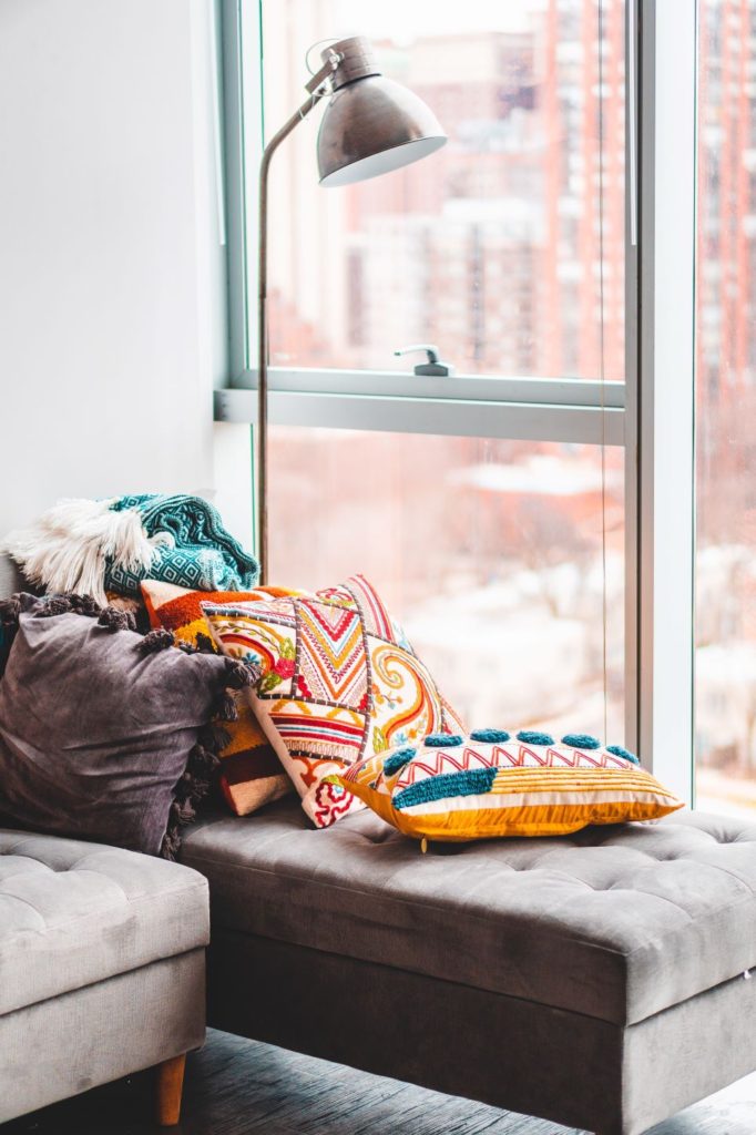 Cozy spot with colorful pillows by the window
