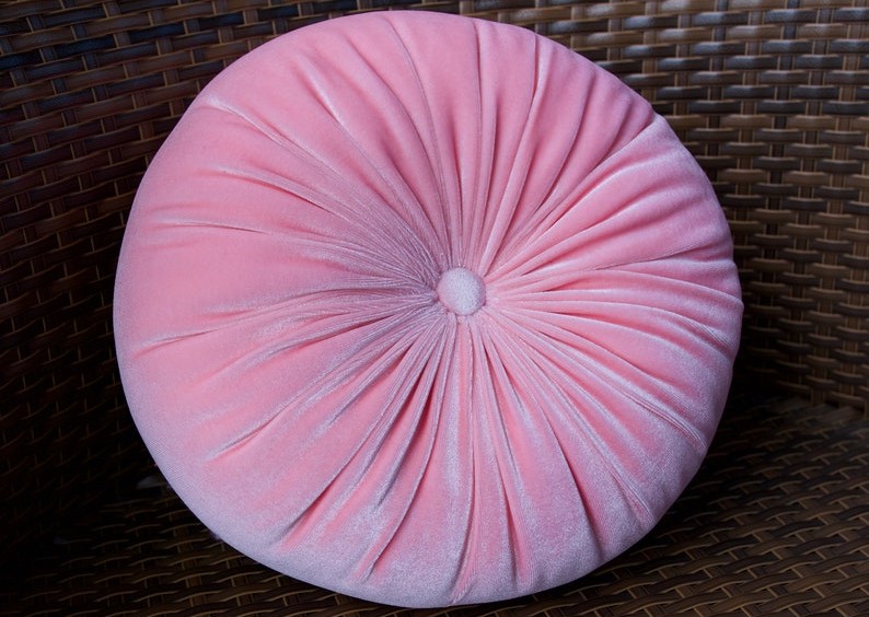 round pink velvet cushion