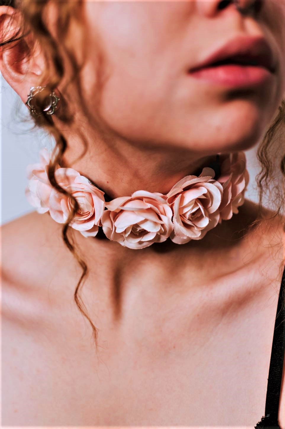 Girl in pale pink flower choker