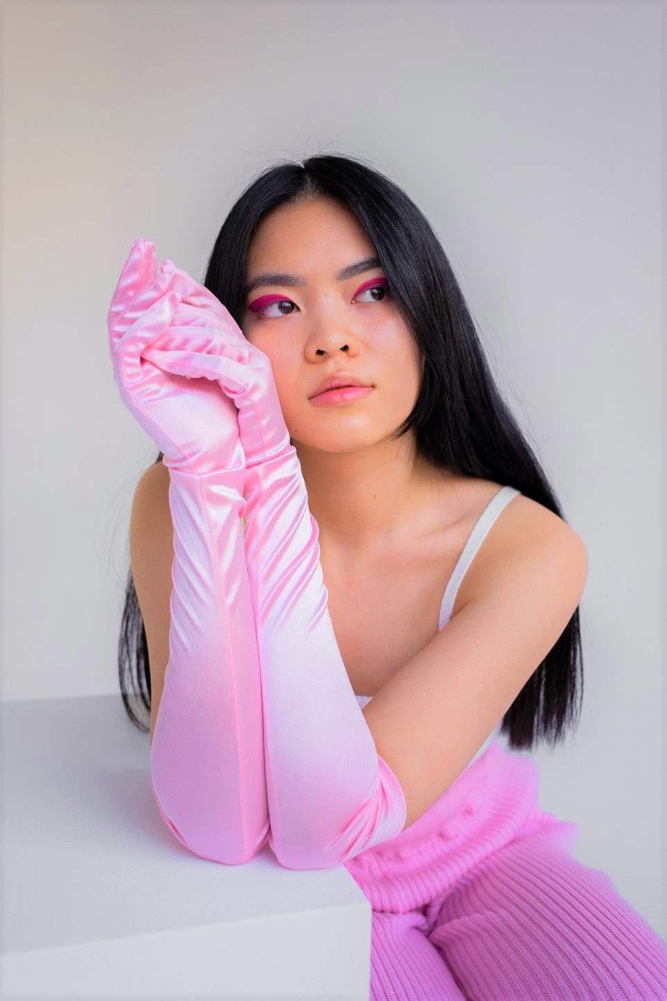 Girl in light pink silk gloves
