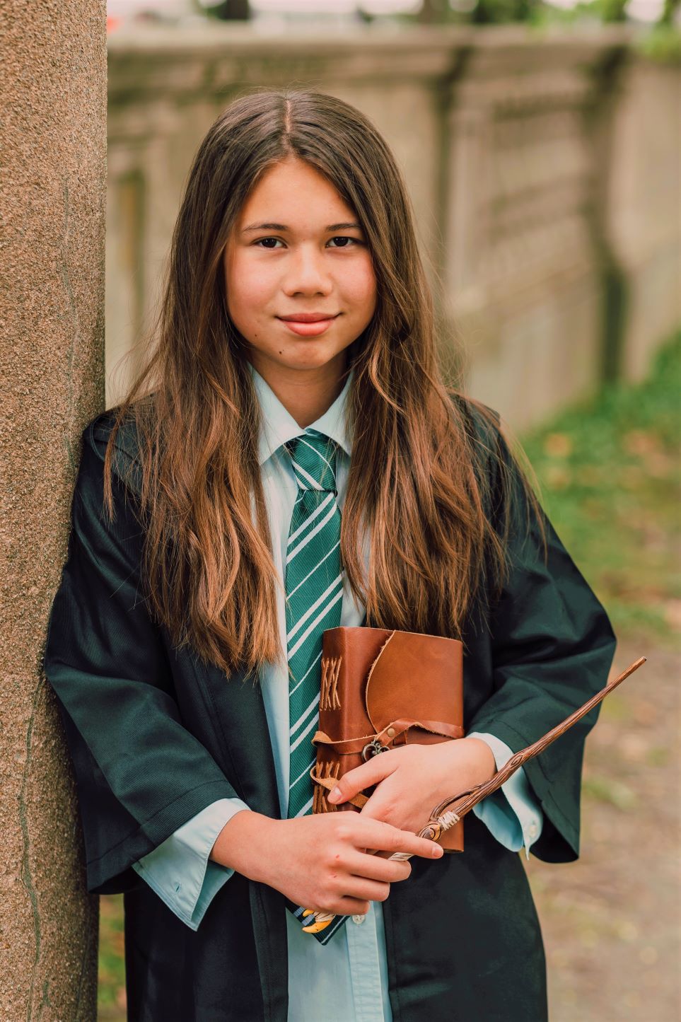 Girl dressed in Slytherin robes