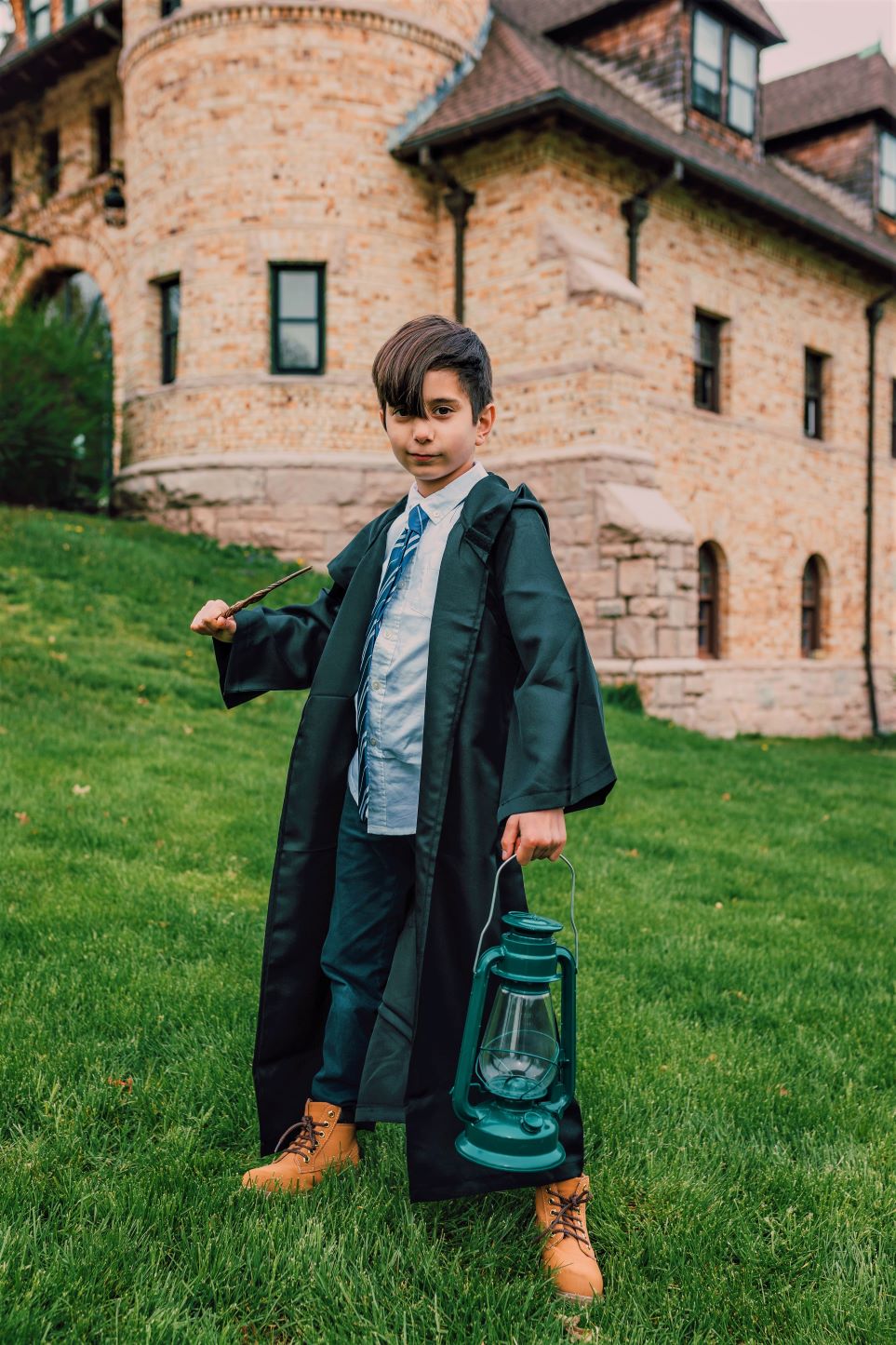 Boy dressed in Slytherin robes