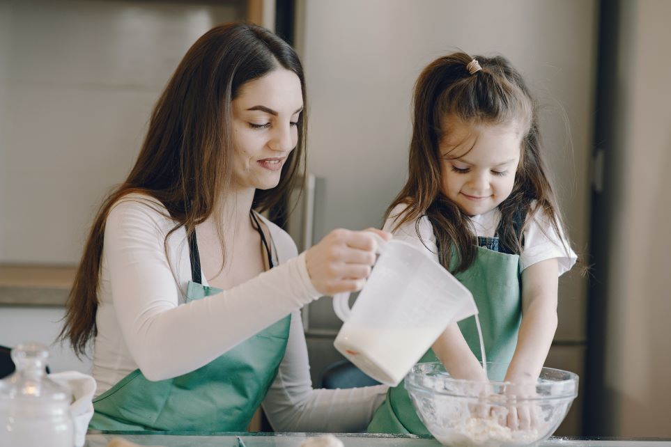 Child helping mama bake