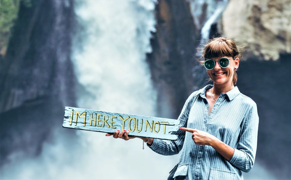 Woman on vacation, smiling for photo