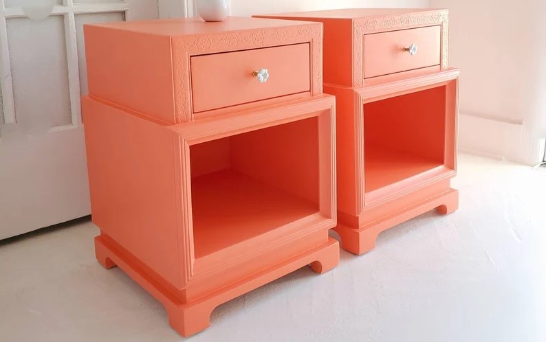 set of 2 coral painted art deco end tables count as functional decor: both attractive and serving a purpose