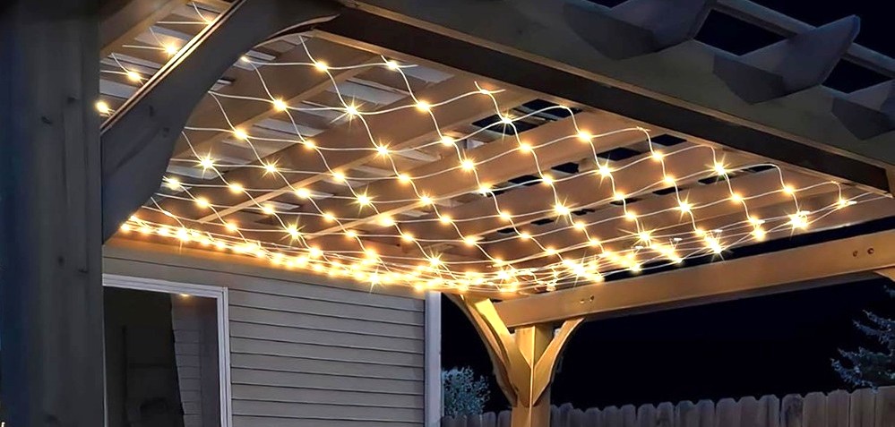 String lights net hung from ceiling of outdoor terrace