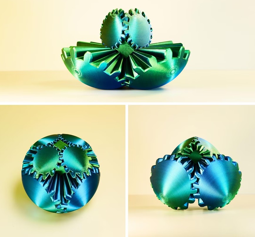 Giving small business gifts is even better when they're fun and unique, like this mesmerizing green-gradient gear fidget ball. Ball is seen in three versions. Bottom left is ball-shape, bottom right shows it starting to open as you turn the gears, and top photo shows it open so the big gear portions are on bottom and small ones stick out on top
