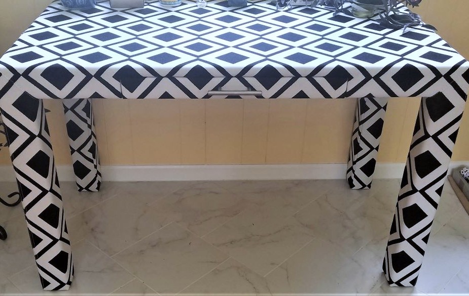 black and white diamond patterned upholstered table/desk