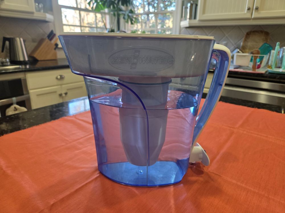 A water filter pitcher is important for almost anyone's collection of household products, but this ZeroWater filter pitcher as seen in photo atop a kitchen counter is especially purifying because it removes all particulates
