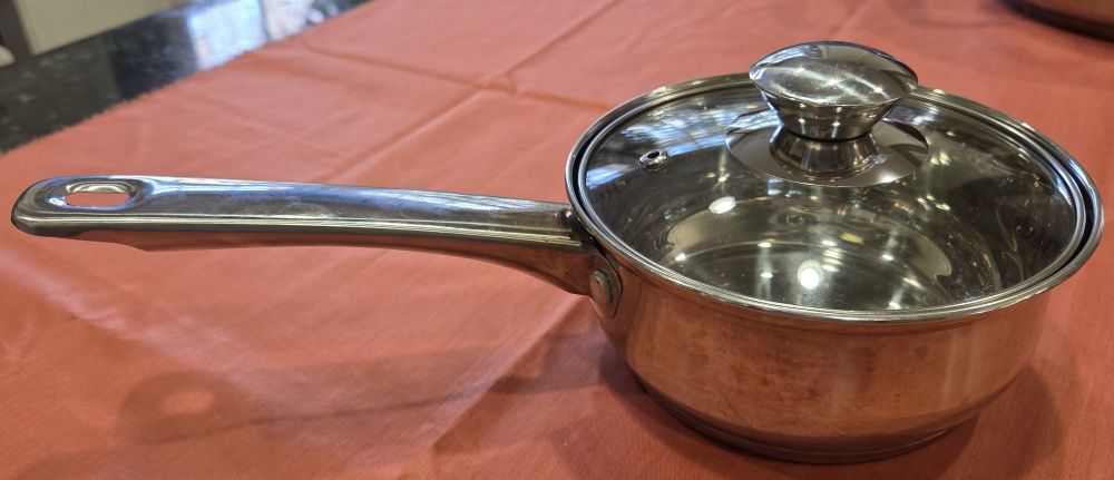 A small stainless steel saucepan with its lid, depicted here, is one of those foundational household products for the kitchen because stainless steel is a toxin-free material.