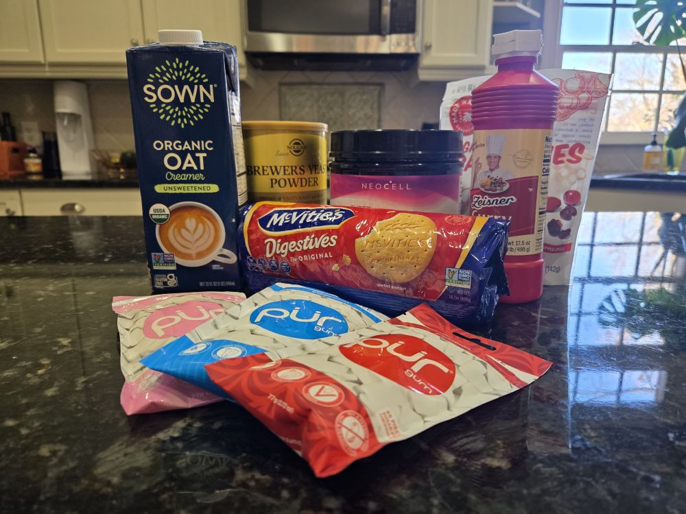 My favourite household products are the ones you eat: food! Seen in photo is an array of food products atop a kitchen counter, including SOWN organic oat creamer, brewer's yeast powder, collagen (label unseen behind digestives), McVitie's digestives, curry ketchup, cranberries, and pur gum.