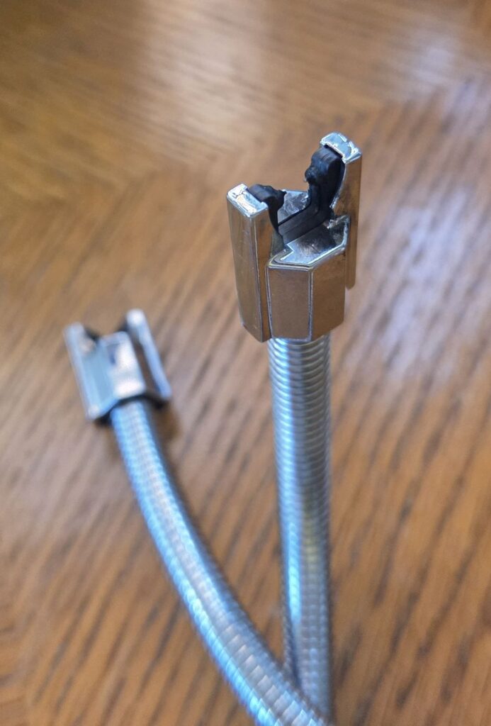 Close-up photo of the tip of an electric lighter where the arc connects to light