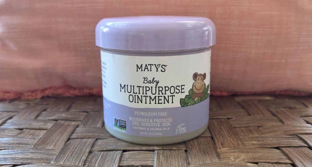 Closeup view of a jar periwinkle-coloured jar of Maty's Baby Multipurpose Ointment, used for diaper care but also for chapped skin for anybody - one of the most useful skincare-oriented household products to have on hand