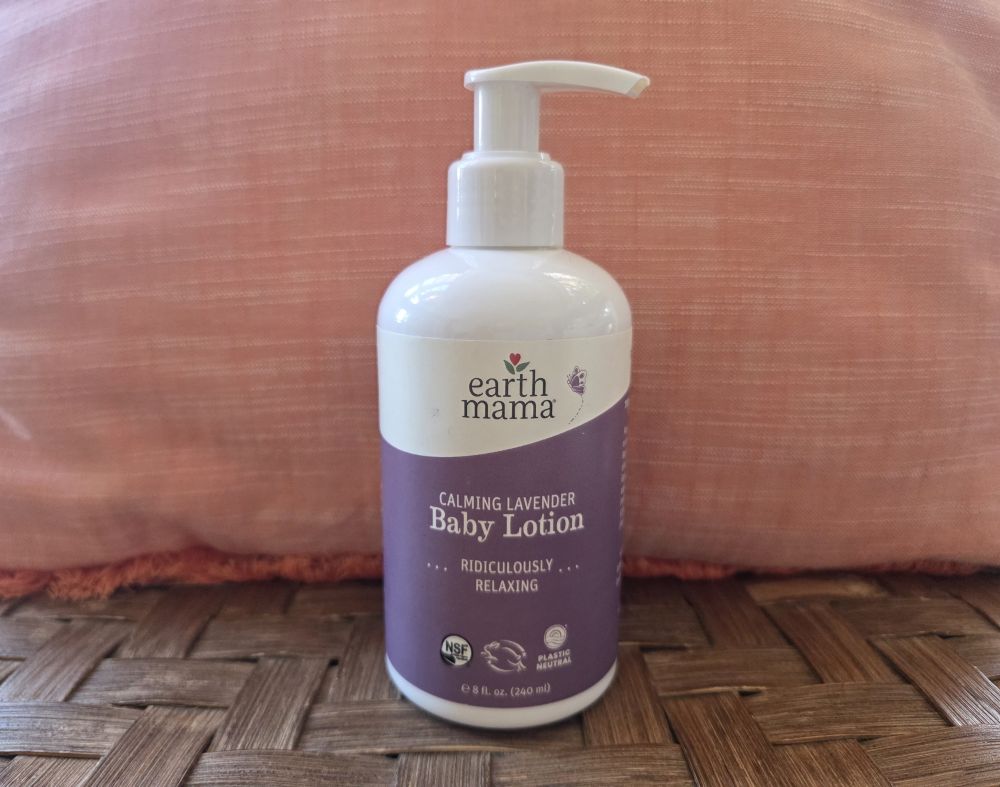 Bottle of Earth Mama lavender baby lotion with a purple label reading 'ridiculously relaxing' - a tried and true household product for kids' skincare for years