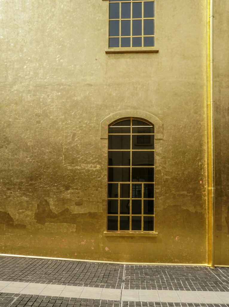 A completely gold building at the Prada Fondazione, Milan by OMA architect